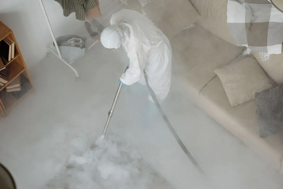 Biohazard cleanup technician in protective equipment, Long Branch, VA
